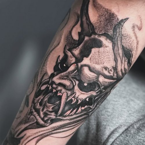 Black demon tattoo