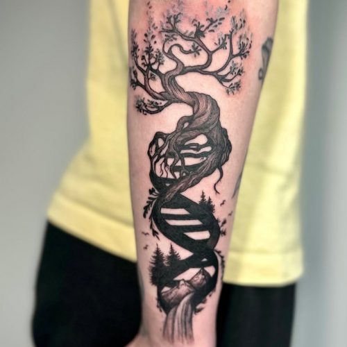 Blackwork tree tattoo on forearm