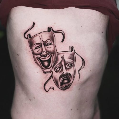 Masks tattoo on ribs