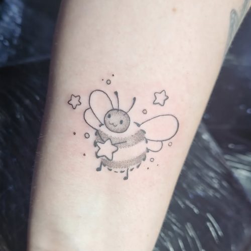Fine line bee tattoo
