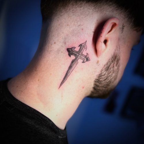 Blackwork cross tattoo on neck.