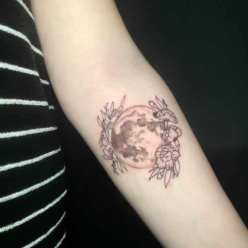 Moon and flowers tattoo.