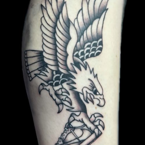 Eagle and a shoe trad tattoo
