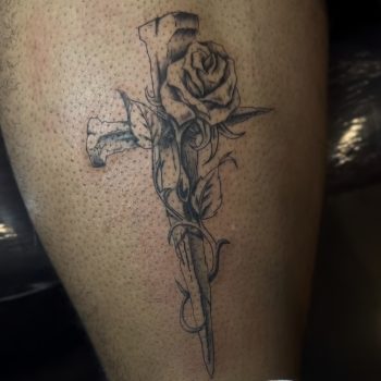 Rose and dagger realism tattoo