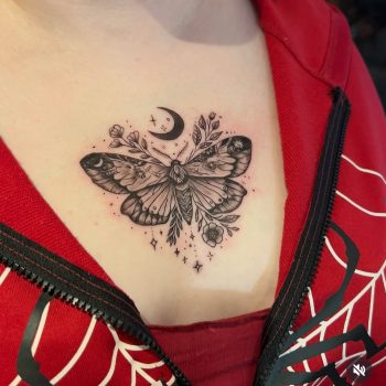 Butterfly chest tattoo