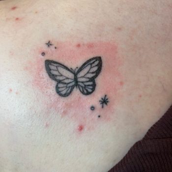 Blackwork butterfly tattoo