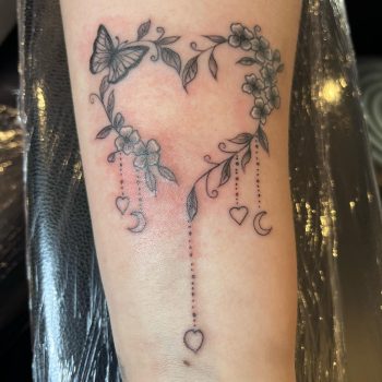 Floral heart shape tattoo